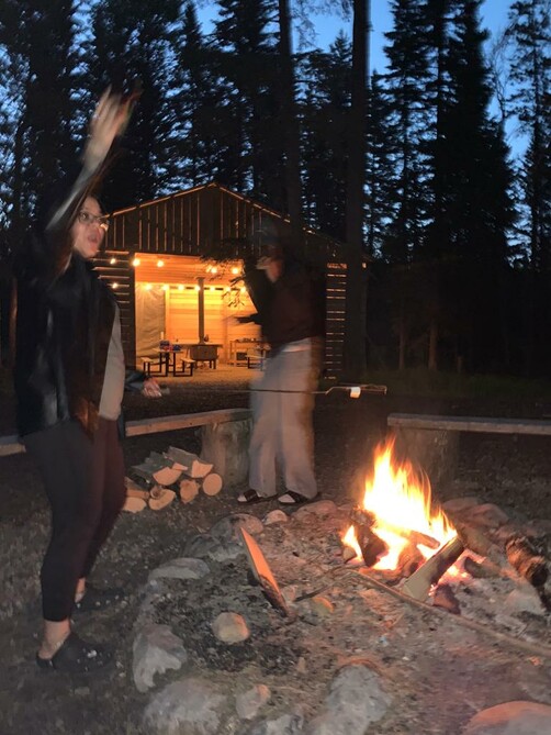 Global Connect youth dancing around the fire at Painted Warriors Ranch